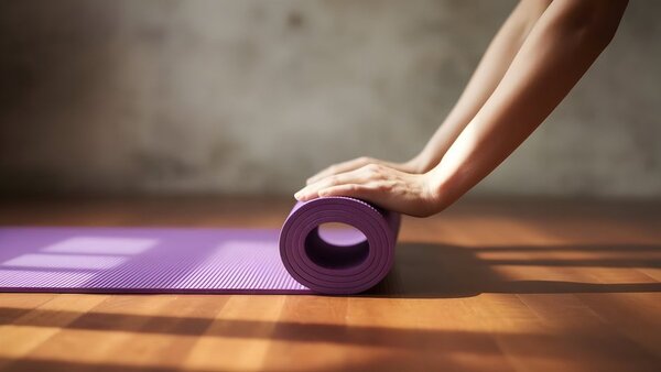 Quiet corner with a yoga mat and sunlight